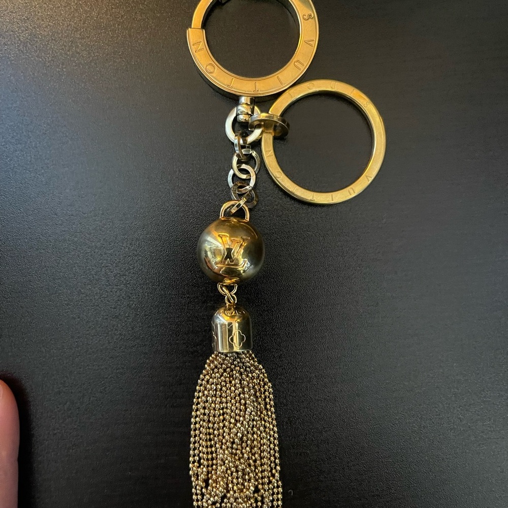 Authentic Louis Vuitton gold bag charm